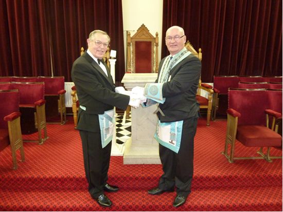 John Bartram received a cheque from Colin Wilson for Fragile X